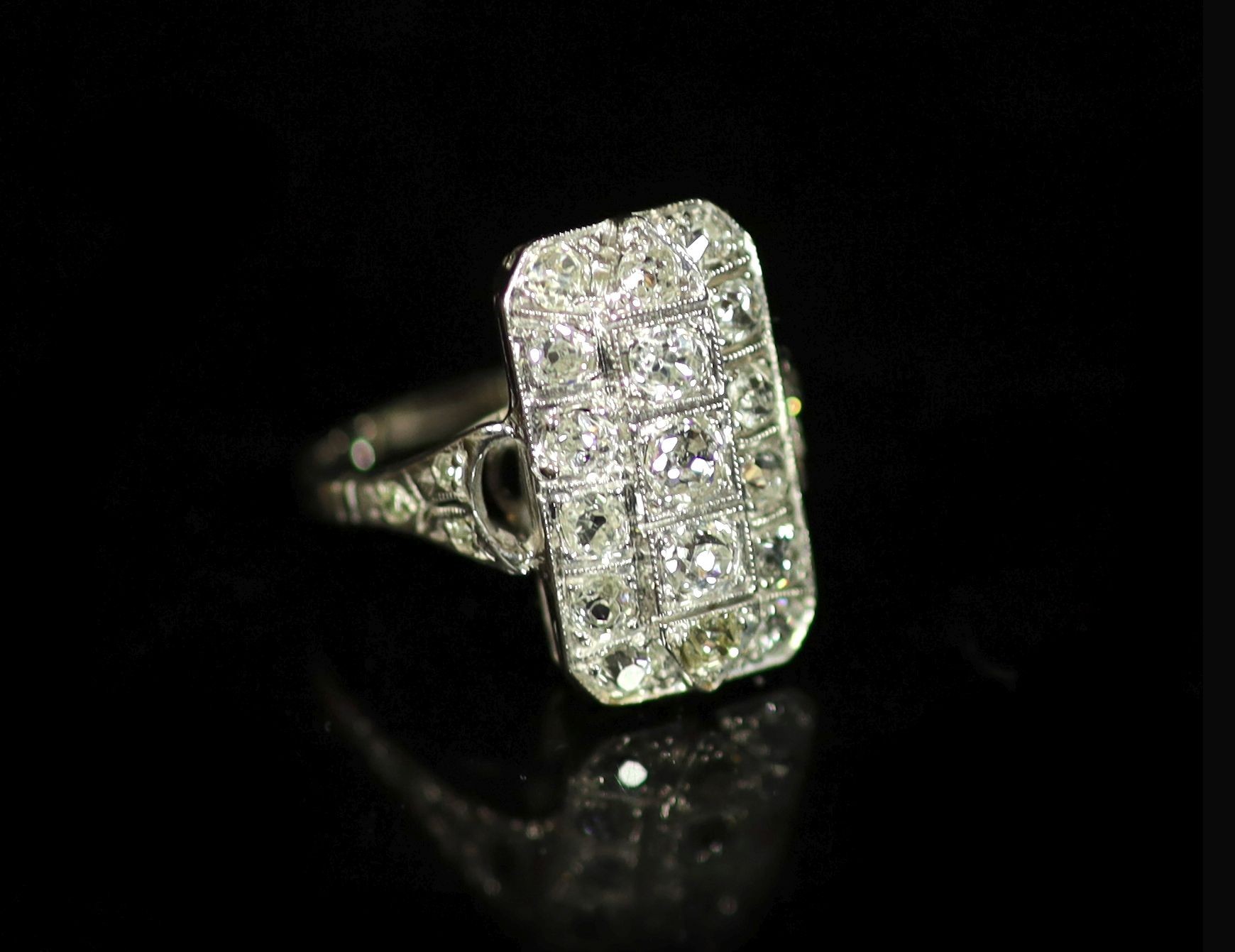 A 1930's/1940's white gold? and diamond cluster tablet ring